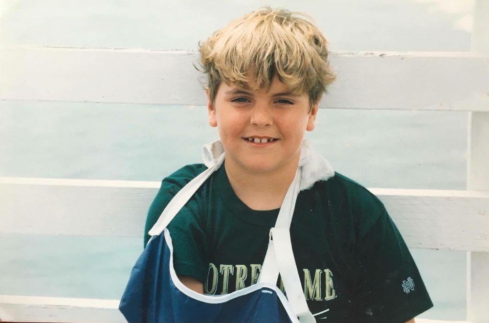 Rob as a kid in a team uniform